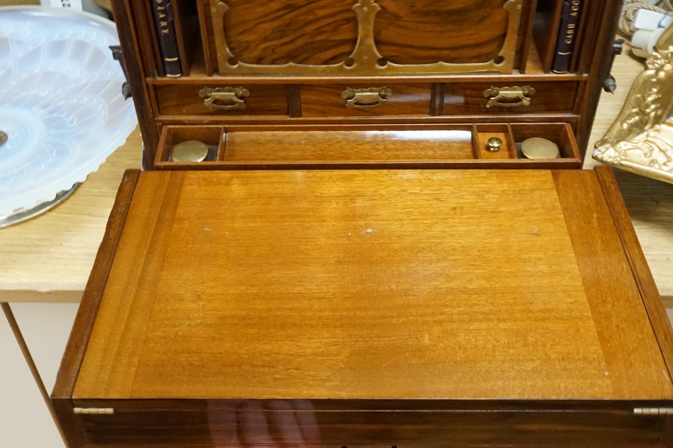 A Victorian carved walnut stationery case with Bramah lock, 42cm wide